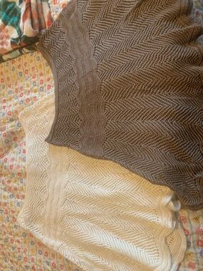 Two textured skirts, brown and cream.